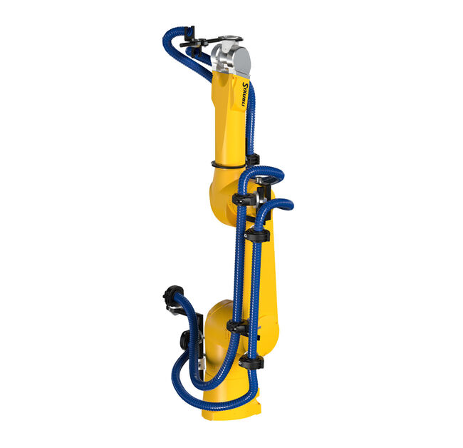 Yellow STÄUBLI robot with blue corrugated hose solution, a complete system support.